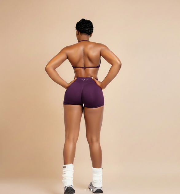 Woman in plum activewear set